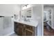 Bathroom with vanity, mirror, and view of bedroom at 9585 Hutcheson Ferry Rd, Palmetto, GA 30268