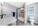 Main bathroom with shower/tub combo and vanity at 9585 Hutcheson Ferry Rd, Palmetto, GA 30268