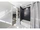 Basement bathroom with dark-tiled shower/tub combo at 9585 Hutcheson Ferry Rd, Palmetto, GA 30268