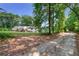 Long driveway leading to house nestled in woods at 9585 Hutcheson Ferry Rd, Palmetto, GA 30268