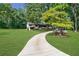 House with curved driveway and lush lawn at 9585 Hutcheson Ferry Rd, Palmetto, GA 30268