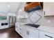 Modern kitchen boasts white shaker cabinets, quartz countertops, and a stylish range hood at 9585 Hutcheson Ferry Rd, Palmetto, GA 30268