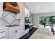 Modern kitchen with white cabinets, quartz countertops and a farmhouse sink at 9585 Hutcheson Ferry Rd, Palmetto, GA 30268