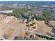 Aerial view showing property, pond and nearby development at 3228 Rosebud Rd, Loganville, GA 30052