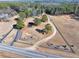 Aerial view showing home, pond, and expansive lot at 3228 Rosebud Rd, Loganville, GA 30052