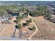 Aerial view of property with pond and long driveway at 3228 Rosebud Rd, Loganville, GA 30052