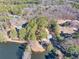 Property features a home, pond, and lush trees at 3228 Rosebud Rd, Loganville, GA 30052