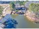 Property with pond, home, and mature trees at 3228 Rosebud Rd, Loganville, GA 30052