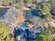 Home with pool and pond, surrounded by trees at 3228 Rosebud Rd, Loganville, GA 30052