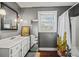 Clean bathroom with white vanity and shower/tub combo at 3228 Rosebud Rd, Loganville, GA 30052