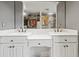 Bathroom with double vanity and a large mirror at 3228 Rosebud Rd, Loganville, GA 30052