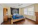 Cozy bedroom with wooden platform bed and hardwood floors at 3228 Rosebud Rd, Loganville, GA 30052