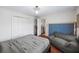 Bedroom with platform bed, hardwood floors, and built-in closet at 3228 Rosebud Rd, Loganville, GA 30052