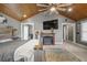 Main bedroom featuring a fireplace and large TV at 3228 Rosebud Rd, Loganville, GA 30052