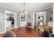 Elegant dining room with hardwood floors and built-in corner shelving at 3228 Rosebud Rd, Loganville, GA 30052