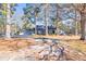 Ranch home with two car garage and mature landscaping at 3228 Rosebud Rd, Loganville, GA 30052