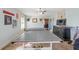 Game room with ping pong table and view into another room at 3228 Rosebud Rd, Loganville, GA 30052