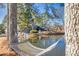 Relaxing hammock overlooks a serene pond and private backyard at 3228 Rosebud Rd, Loganville, GA 30052