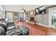 Living room with hardwood floors, fireplace, and built-in shelving at 3228 Rosebud Rd, Loganville, GA 30052