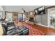Living room with hardwood floors, fireplace, and built-in shelving at 3228 Rosebud Rd, Loganville, GA 30052