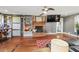 Living room with hardwood floors, fireplace, and built-in shelving at 3228 Rosebud Rd, Loganville, GA 30052