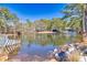 Serene pond view, adjacent to home and lush trees at 3228 Rosebud Rd, Loganville, GA 30052