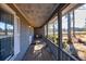Long covered porch with wooden flooring and railing at 3228 Rosebud Rd, Loganville, GA 30052