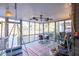 Enjoy lake views from this screened porch with a ceiling fan at 3228 Rosebud Rd, Loganville, GA 30052