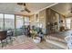 Relaxing screened porch with ceiling fan and wood flooring at 3228 Rosebud Rd, Loganville, GA 30052