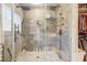 Large walk-in shower with glass doors and multiple shower heads at 3228 Rosebud Rd, Loganville, GA 30052