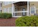 Ground level balcony featuring white railings, a covered space with two doors, and privacy hedges at 411 Berkeley Woods Dr, Duluth, GA 30096