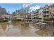 Outdoor common area with fire pit, umbrella-covered tables, barbecue, and seating for residents at 411 Berkeley Woods Dr, Duluth, GA 30096