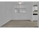Bright dining area featuring new floors and a modern chandelier at 411 Berkeley Woods Dr, Duluth, GA 30096
