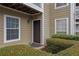 Exterior view of front entrance featuring unit number 411 and lush landscaping at 411 Berkeley Woods Dr, Duluth, GA 30096