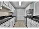 Bright kitchen featuring stainless steel appliances and lots of cabinet space at 411 Berkeley Woods Dr, Duluth, GA 30096