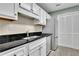 Well-lit kitchen featuring stainless steel appliances and spacious countertop at 411 Berkeley Woods Dr, Duluth, GA 30096