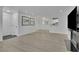 Spacious living room featuring new floors and a pass-through to the kitchen at 411 Berkeley Woods Dr, Duluth, GA 30096