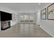 Bright living room featuring a fireplace, large windows, and light wood flooring at 411 Berkeley Woods Dr, Duluth, GA 30096