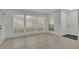 Well-lit living room with new floors and large windows at 411 Berkeley Woods Dr, Duluth, GA 30096