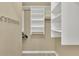 Spacious walk-in closet with custom shelving and ample storage at 411 Berkeley Woods Dr, Duluth, GA 30096
