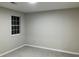 Spacious bedroom with gray carpeting and window at 1485 Reynolds Sw Rd, Atlanta, GA 30331