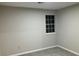 Simple bedroom with grey walls and carpet at 1485 Reynolds Sw Rd, Atlanta, GA 30331