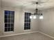 Bright dining room with large windows, new paint and chandelier at 1485 Reynolds Sw Rd, Atlanta, GA 30331