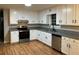 Updated kitchen with stainless steel appliances and granite countertops at 1485 Reynolds Sw Rd, Atlanta, GA 30331