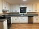 Updated kitchen with stainless steel appliances and granite countertops at 1485 Reynolds Sw Rd, Atlanta, GA 30331