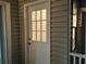 Exterior laundry room with white door and window at 1485 Reynolds Sw Rd, Atlanta, GA 30331