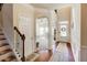 Elegant entryway with hardwood floors, views to living room and office, and a staircase at 45 Silver Peak Dr, Covington, GA 30016