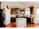 Modern kitchen with dark cabinets, granite countertops, and an island at 45 Silver Peak Dr, Covington, GA 30016