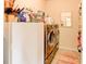 Laundry room with washer, dryer, and extra storage at 45 Silver Peak Dr, Covington, GA 30016