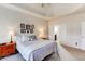 Large main bedroom with tray ceiling and carpeted floor at 45 Silver Peak Dr, Covington, GA 30016